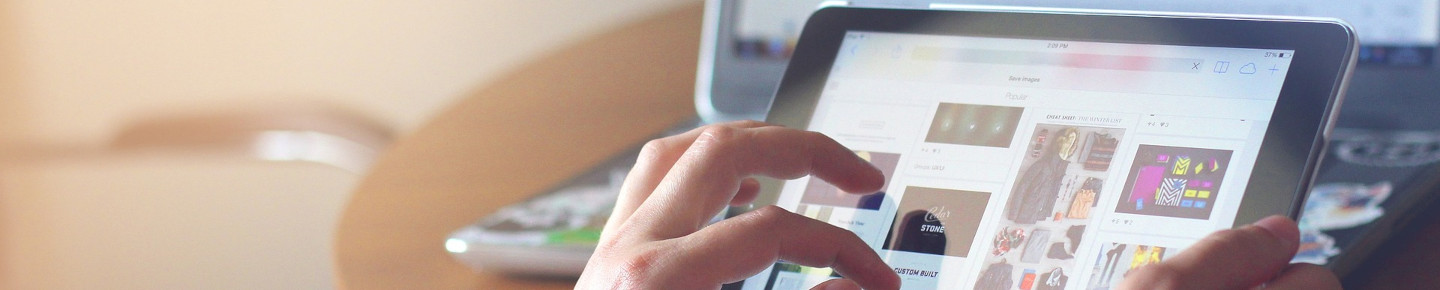 A person uses an iPad. 