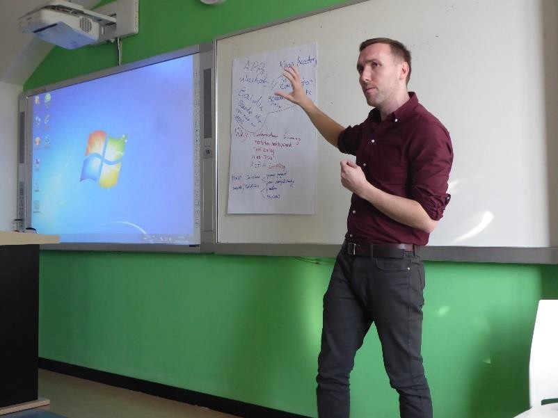 Teacher standing at whiteboard