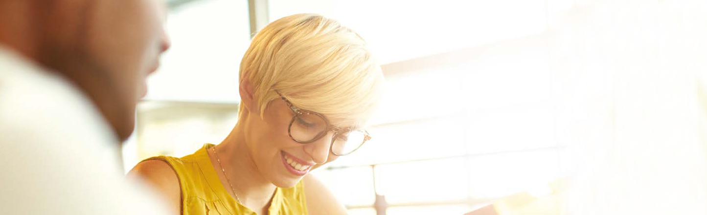 Man and woman talking whilst studying