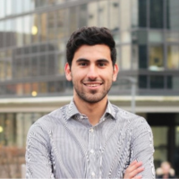 Headshot of Amir Saemi smiling