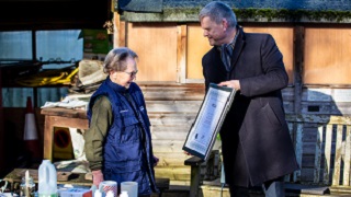 Professor Robert Van de Noort presenting Monica Jobson with her award