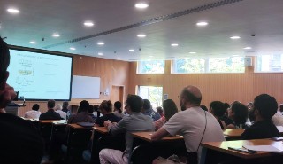 Conference delegates watching a lecture in a lecture hall at the University of Reading
