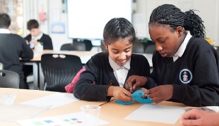 Two primary school children work together Two primary school children work together