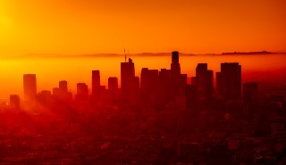 Sunrise over city smog