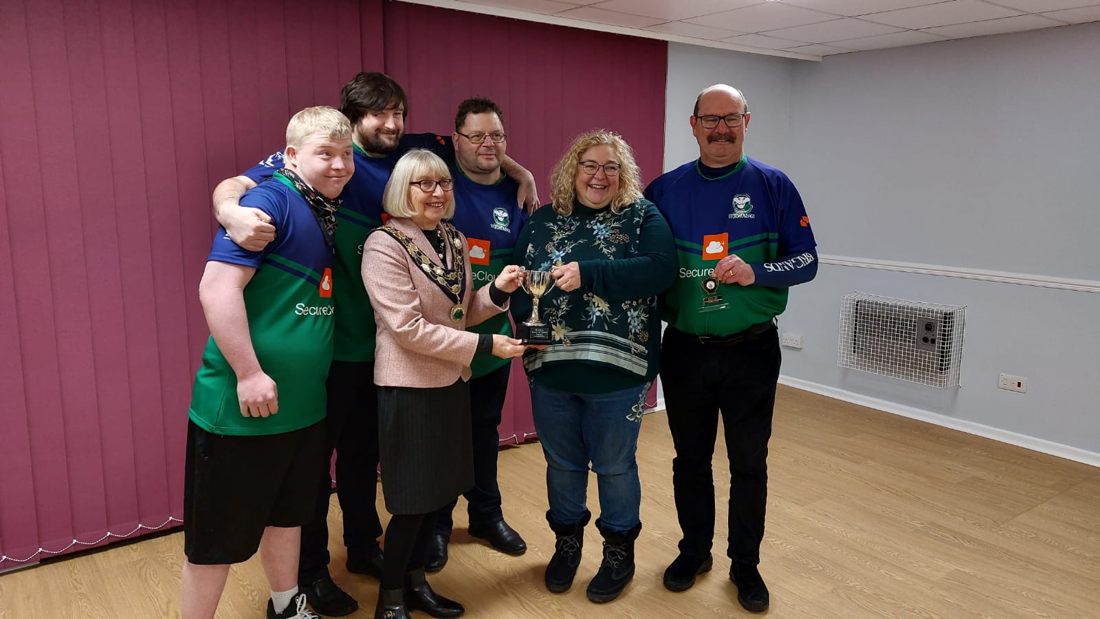 Colin Stonehouse and family being presented with a trophy