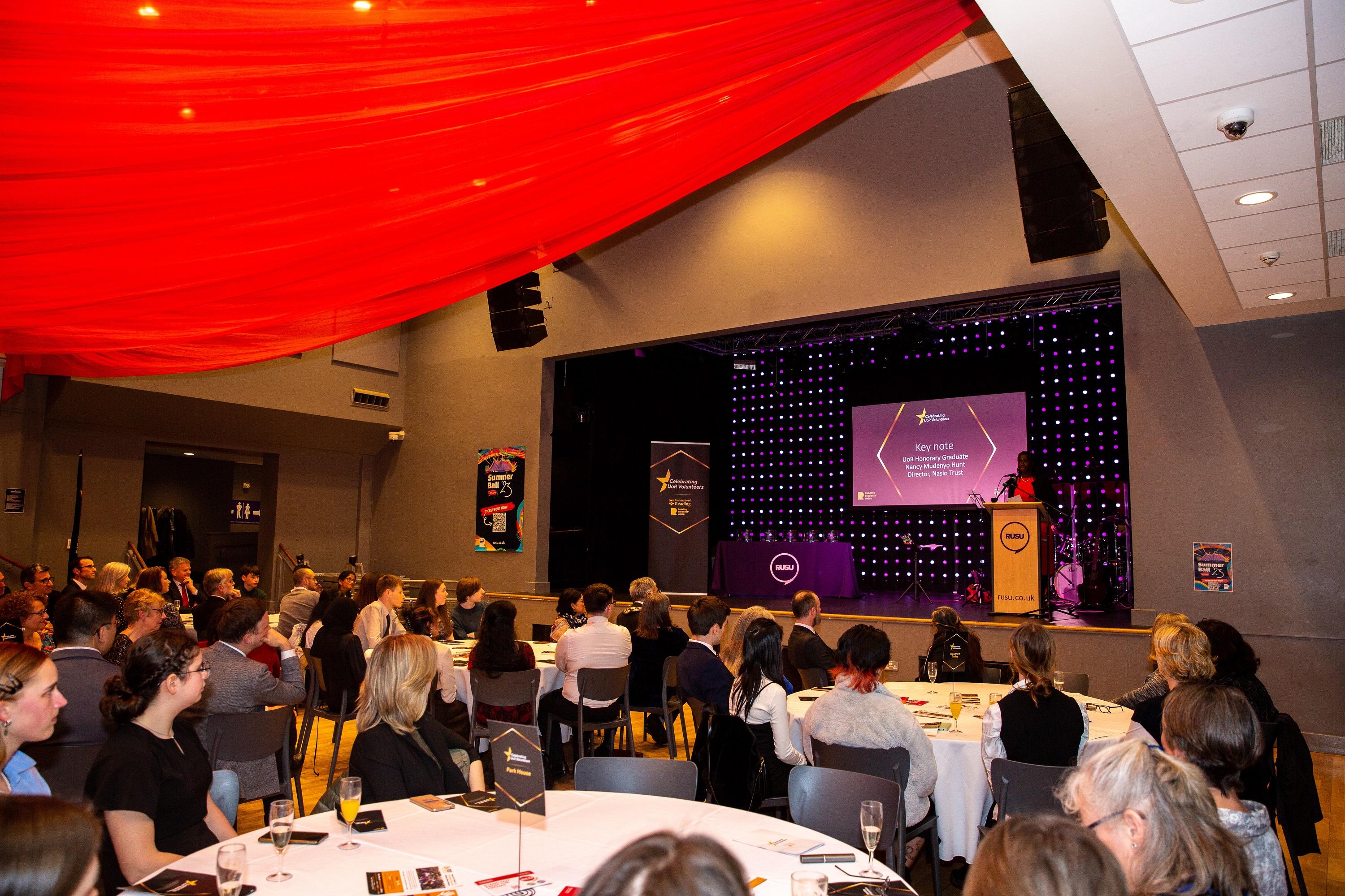 People listening to the keynote speech by Nancy Mudenyo Hunt at the Celebration of Volunteering awards