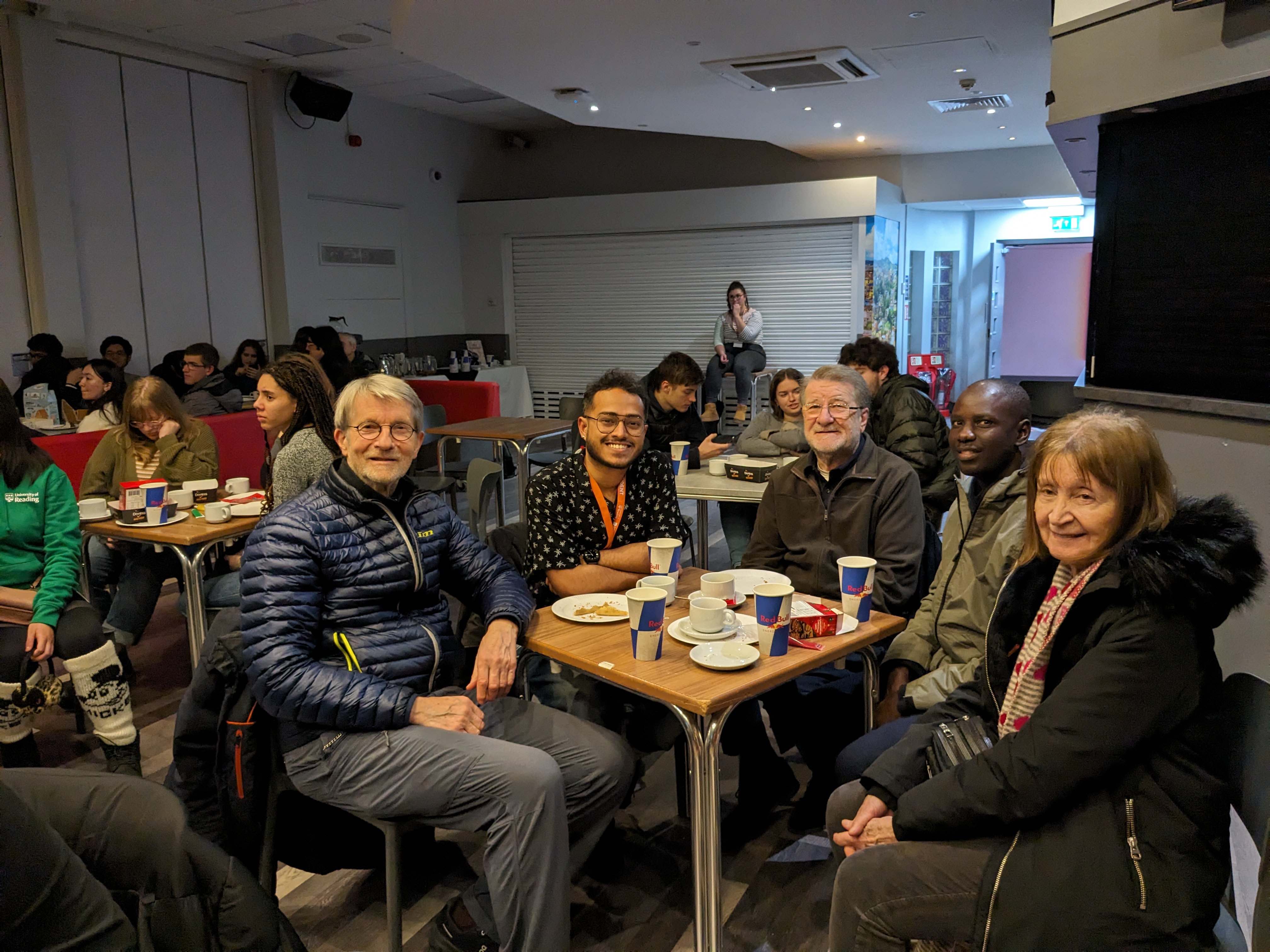 Students and residents sit together for the community event