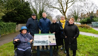 The University Vice-Chancellor pictured with the new heritage board and members of the Friends of Christchurch Green