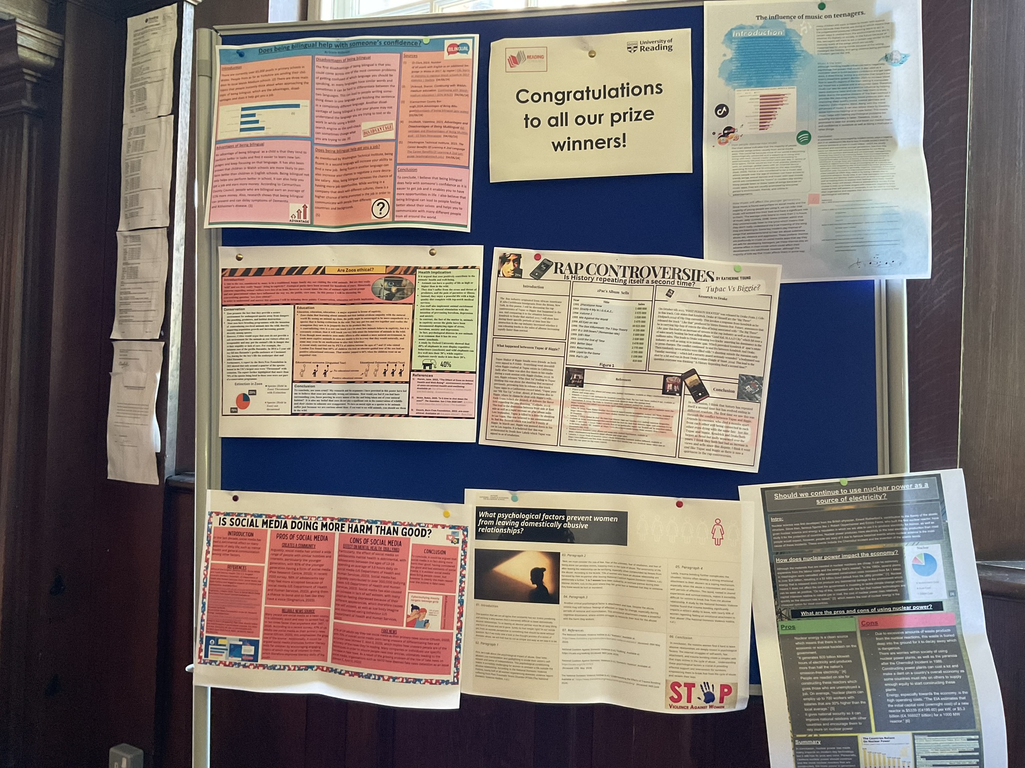 A display of posters pinned to a noticeboard