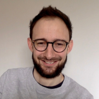 Chris Daw looking straight at the camera and smiling.