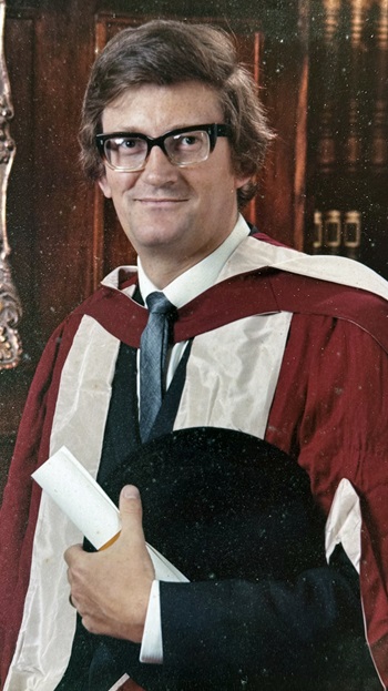 Keith Watson, dressed in academic robes at his PhD ceremony at the University of Reading in 1973