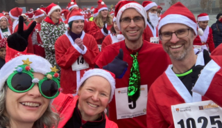 UoR staff dressed as running santas pose for a selfie