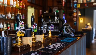 A row of beer taps on the bar in Park House