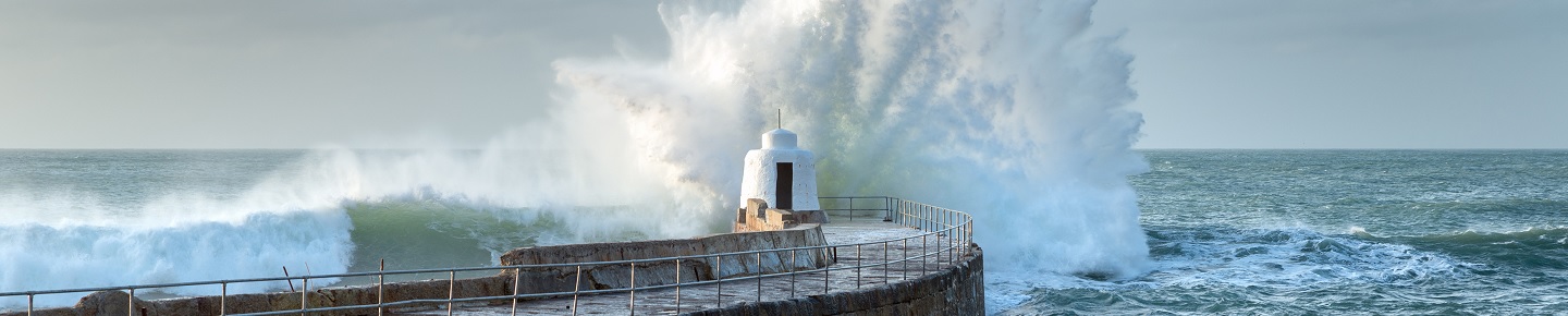 Wave crashing on a pier 