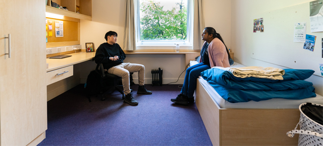 Students talking in studio bedroom