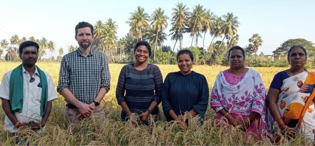 6 people standing in a crop field