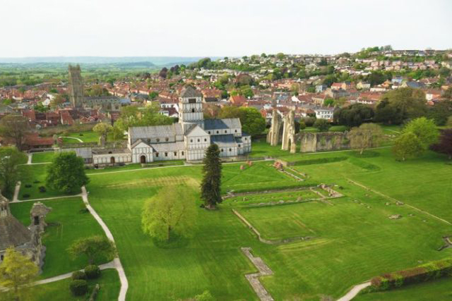 Church and ruins in Glastonbury filmed from an aerial drone